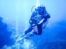 Picture of a diver with a video camera